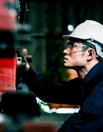 Technician performing machinery maintenance and inspection work – THG Engineering Singapore